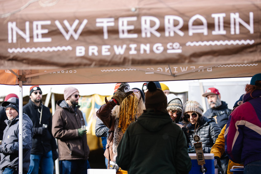 People finish their beers to get a refill at New Terrain's beer tent Saturday at UllrGrass.